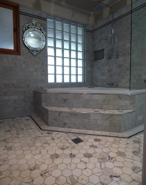 Photo of Thornton Italian styled bathroom with a corner spa