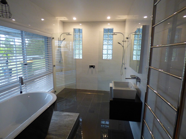 Completed photos of an ensuite renovation at Farley with a freestanding bath on a platform with a double ended shower