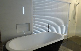 Completed photos of an ensuite renovation at Farley with a freestanding bath on a platform