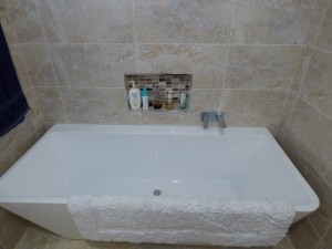 Photos of a modern style bathroom renovation at Ellalong with a freestanding bath